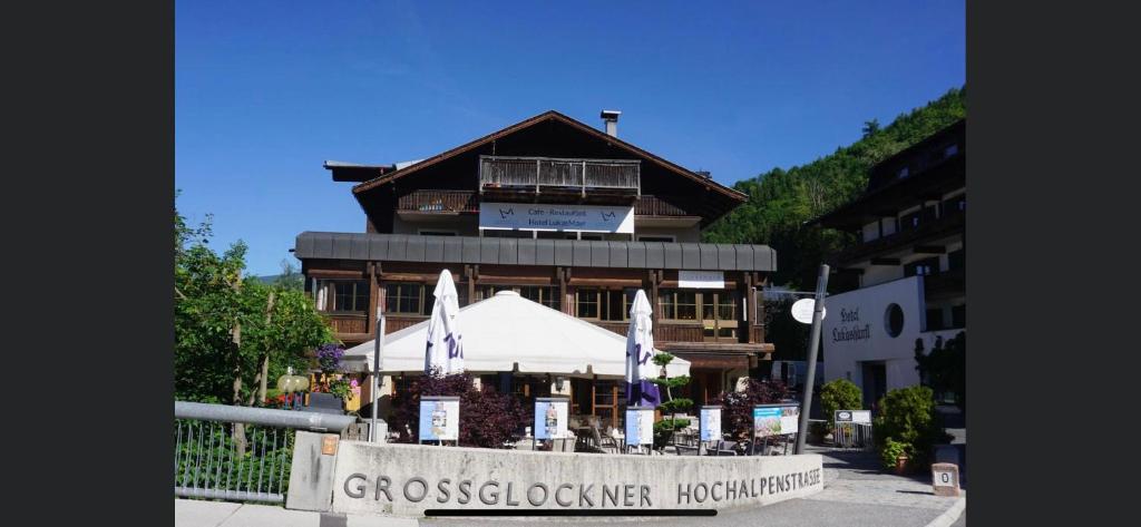 a building with a sign in front of it at Hotel LukasMayr in Bruck an der Großglocknerstraße