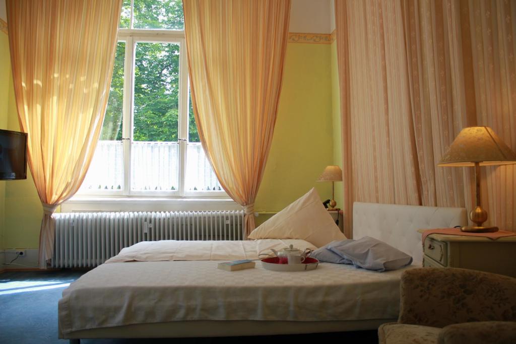 Giường trong phòng chung tại Hotel Waldfriede