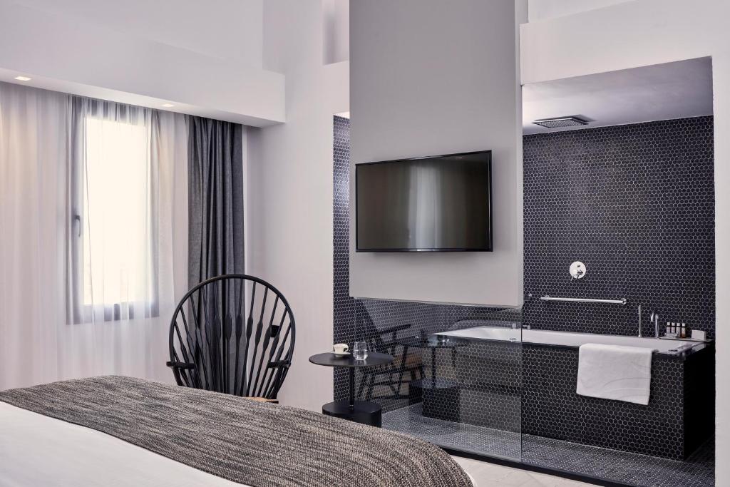 Postel nebo postele na pokoji v ubytování Atlantica Caldera Palace