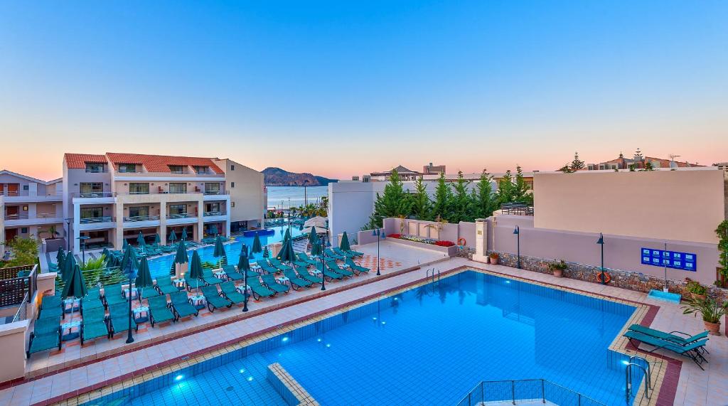 an image of a swimming pool at a hotel at Porto Platanias - Casa Di Porto in Plataniás