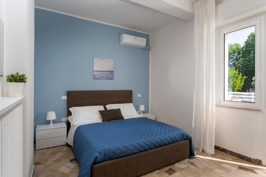 Posteľ alebo postele v izbe v ubytovaní Appartamenti Villa Miramare