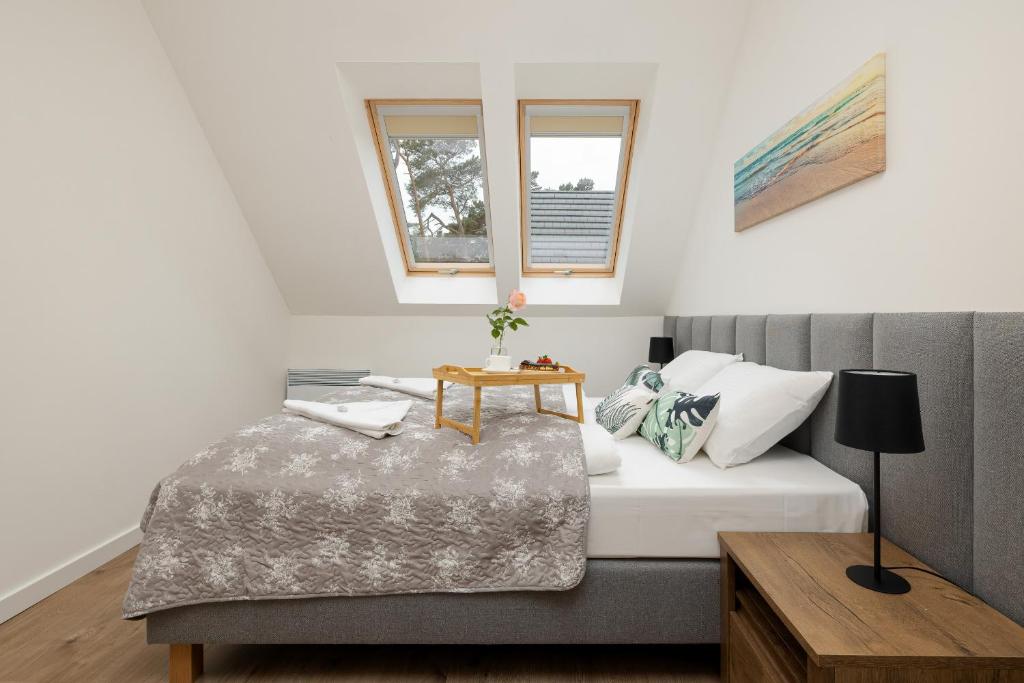Posteľ alebo postele v izbe v ubytovaní Apartamenty Zielona 11 by Noclegi Renters