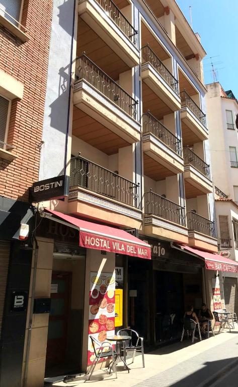 a building with a sign for a hossein wasler tea room at Hostal Vila del Mar in Lloret de Mar