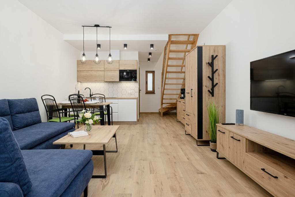Televízia a/alebo spoločenská miestnosť v ubytovaní Apartamenty Zielona 11 by Noclegi Renters