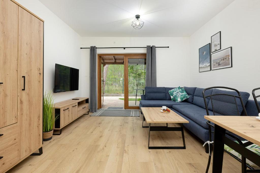 Televízia a/alebo spoločenská miestnosť v ubytovaní Apartamenty Zielona 11 by Noclegi Renters