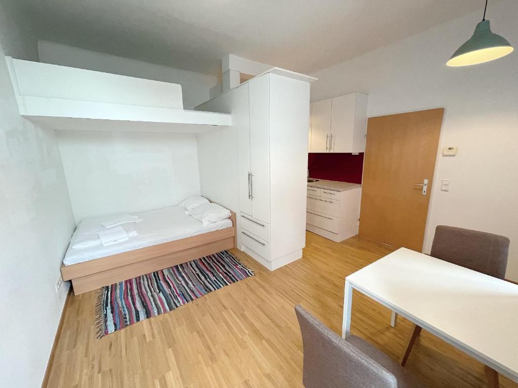 Posteľ alebo postele v izbe v ubytovaní Metro Apartments Vienna