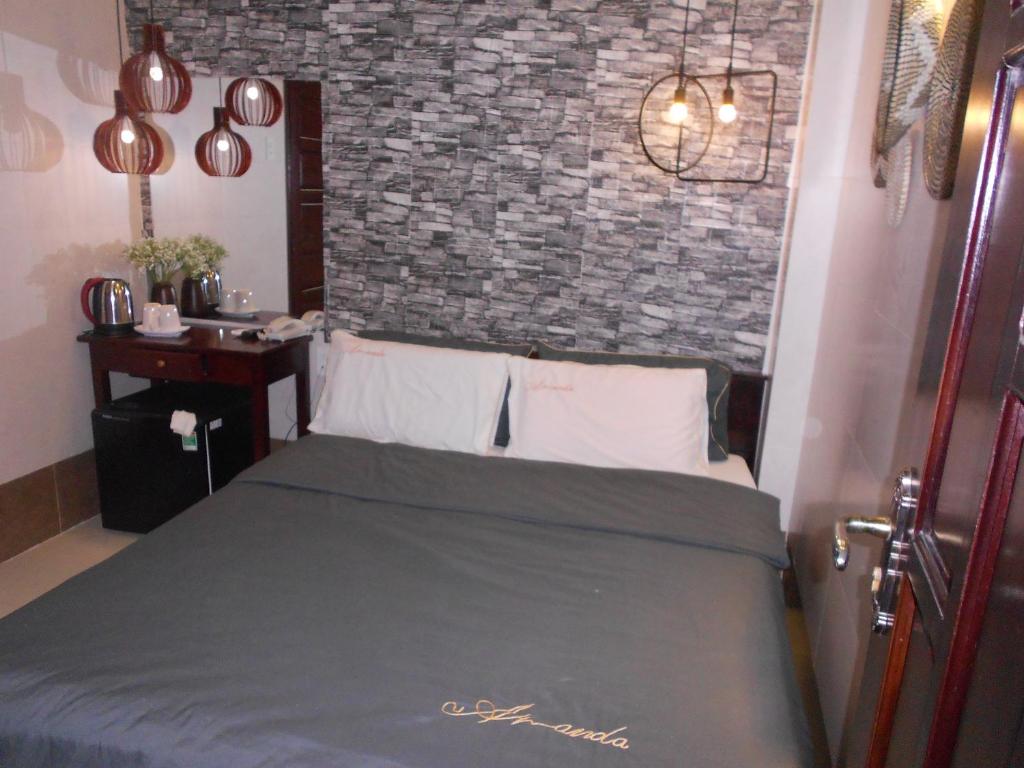 Postel nebo postele na pokoji v ubytování Thanh Hằng Homestay