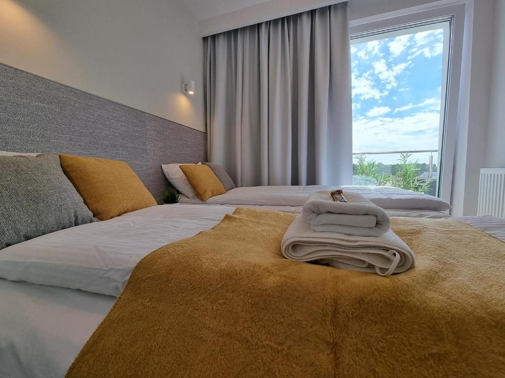Postel nebo postele na pokoji v ubytování Apartament Południowy Gąski - 365PAM