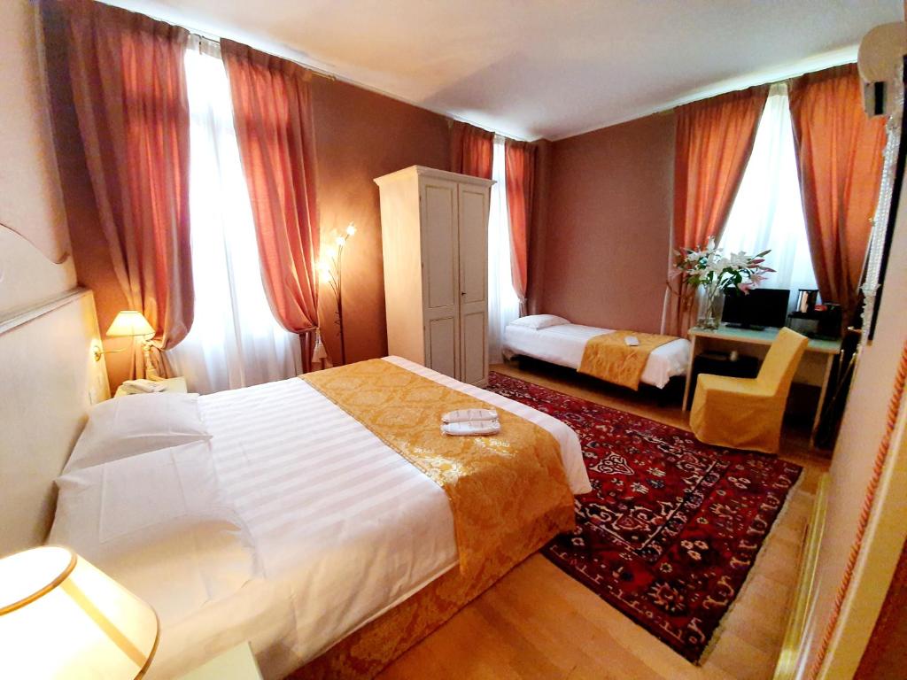 Postel nebo postele na pokoji v ubytování Hotel Corte dei Greci