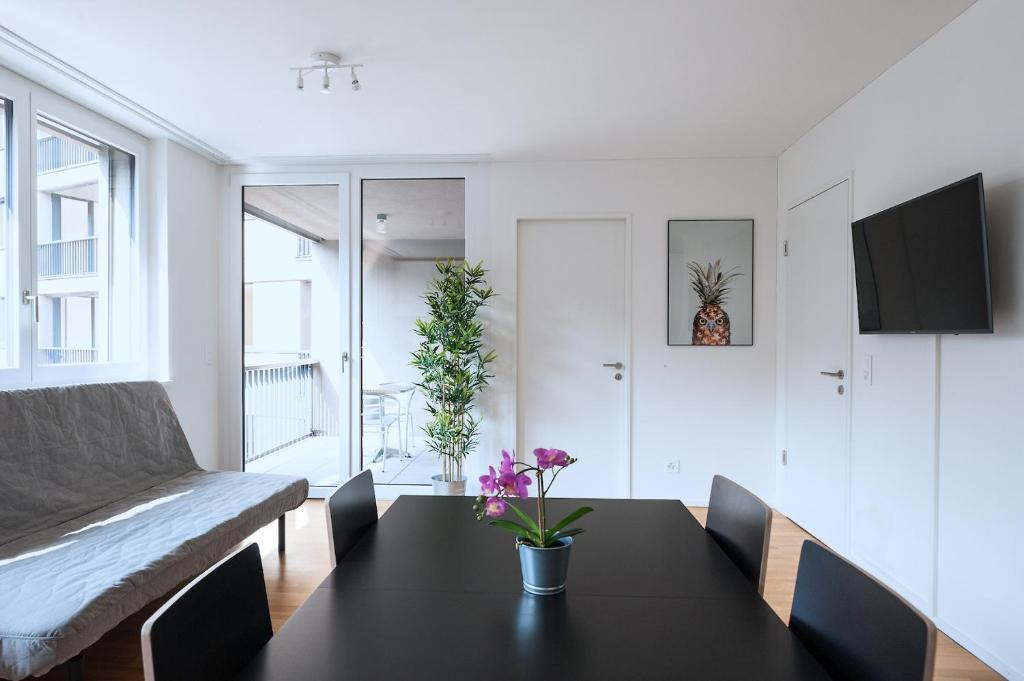 TV a/nebo společenská místnost v ubytování HITrental Messe Apartments