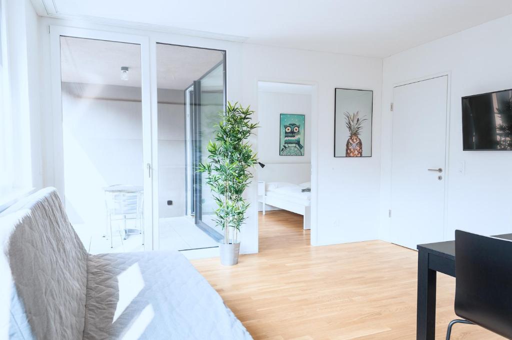 TV a/nebo společenská místnost v ubytování HITrental Messe Apartments