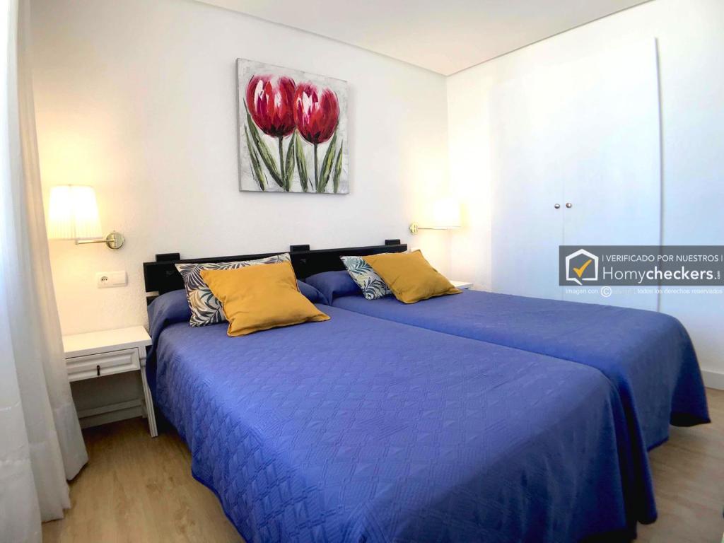 Posteľ alebo postele v izbe v ubytovaní COZY APARTAMENTO CENTRO TORREMOLINOS