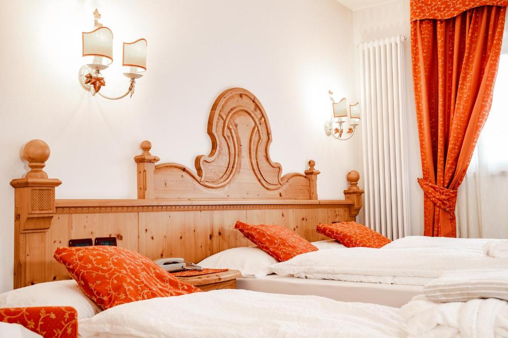 Postel nebo postele na pokoji v ubytování Residence La Moretina