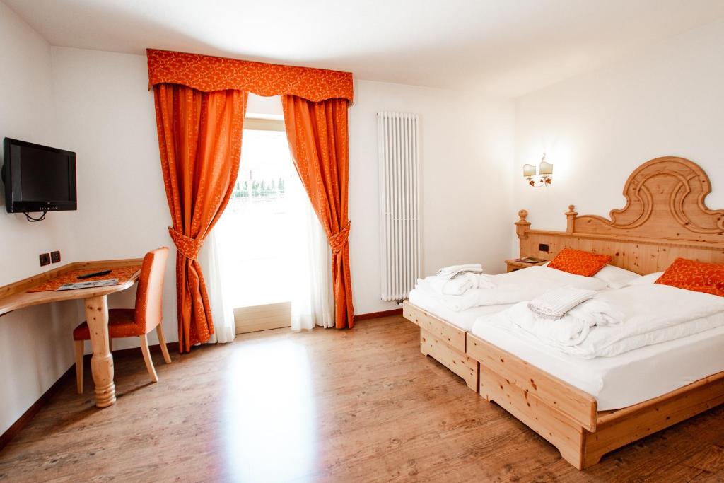 Postel nebo postele na pokoji v ubytování Residence La Moretina