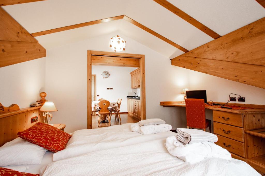 Postel nebo postele na pokoji v ubytování Residence La Moretina