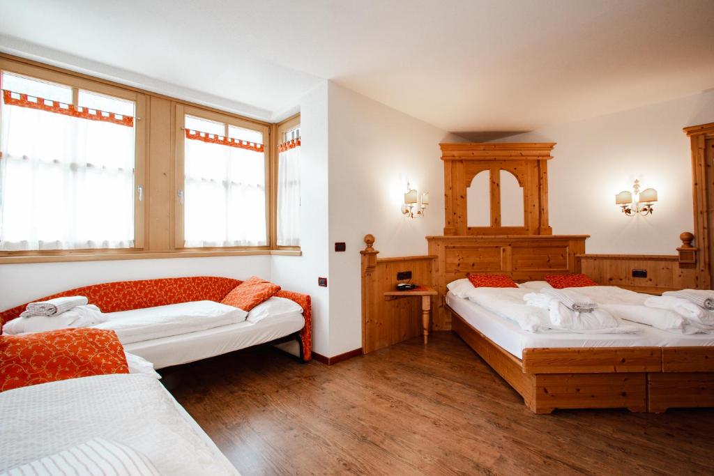 Postel nebo postele na pokoji v ubytování Residence La Moretina