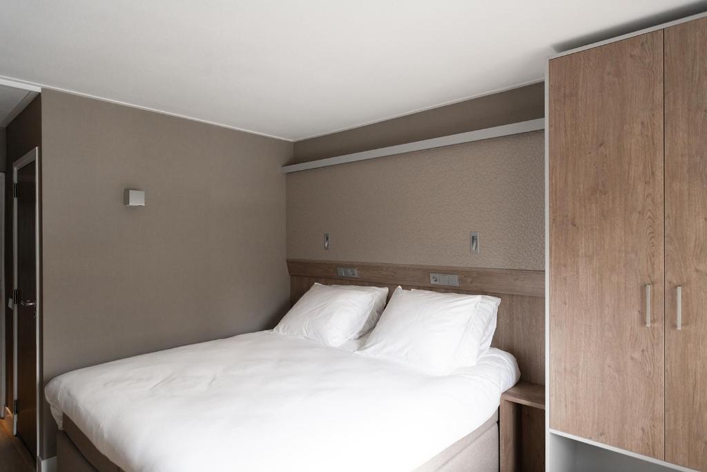 Postel nebo postele na pokoji v ubytování Hotel de Werelt