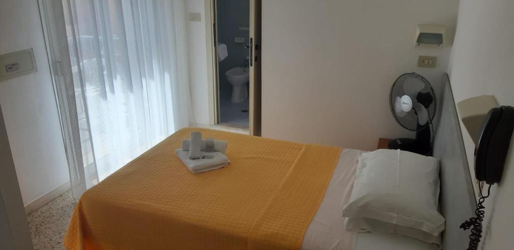 Postel nebo postele na pokoji v ubytování Hotel Très Jolie
