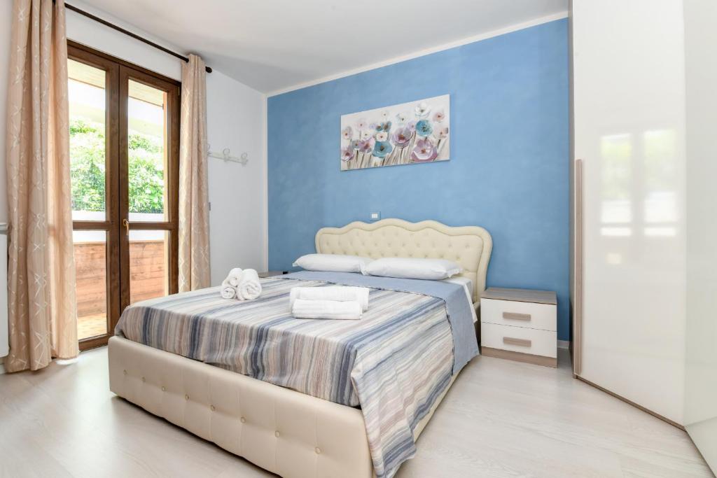 Säng eller sängar i ett rum på My Desenzano Holiday Apartment