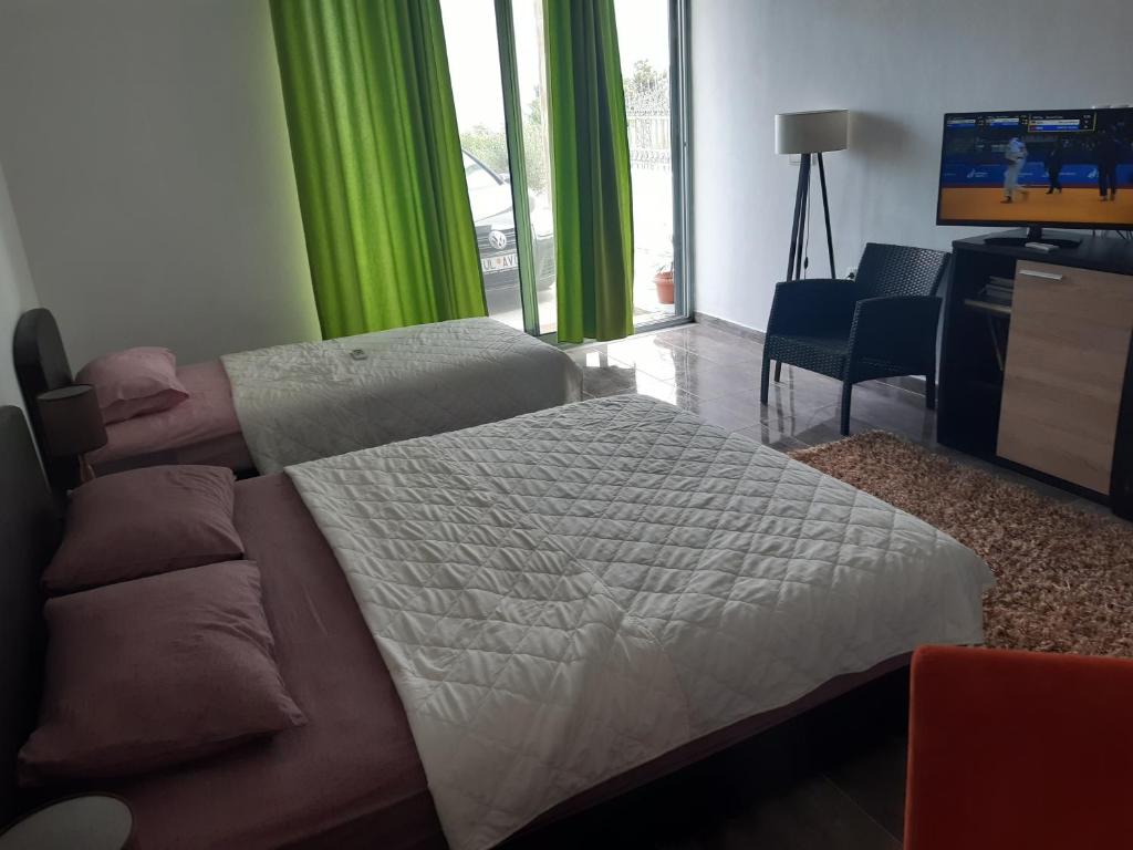 Cama ou camas em um quarto em Zara Apartments