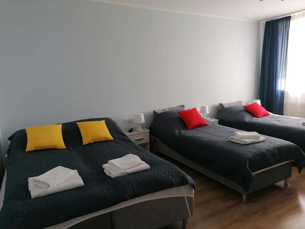 Posteľ alebo postele v izbe v ubytovaní Gladiator Noclegi Zator lV Apartament