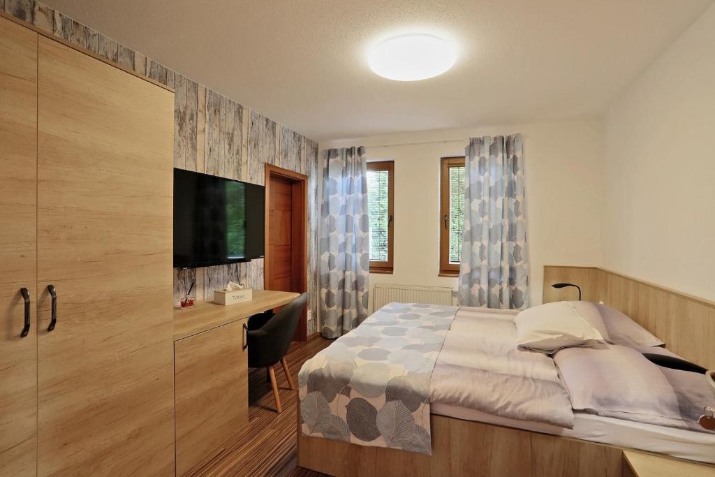 Letto o letti in una camera di ELTAKO penzion