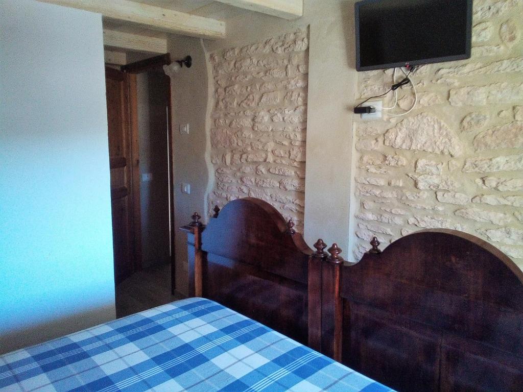 Postel nebo postele na pokoji v ubytování Da Andrea e Raffaella