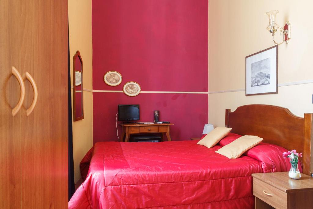 Postel nebo postele na pokoji v ubytování Hotel San Lorenzo