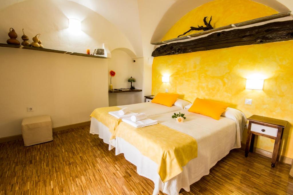 Postel nebo postele na pokoji v ubytování La Posada de Grimaldo