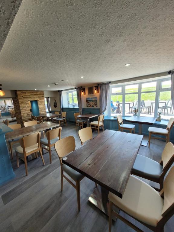 a dining room with a table and chairs at South Sands Hotel in Weston-super-Mare