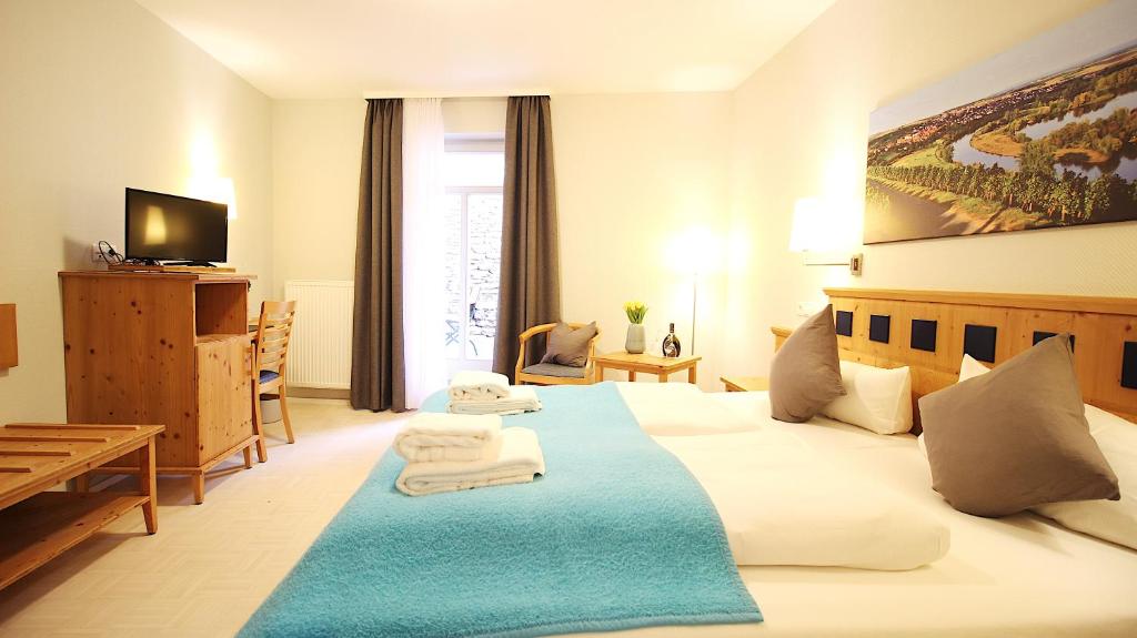 Postel nebo postele na pokoji v ubytování Aparthotel Alte Schmiede Dettelbach