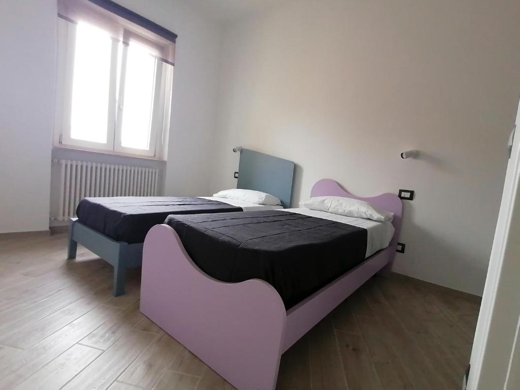 Posteľ alebo postele v izbe v ubytovaní Vasto in centro
