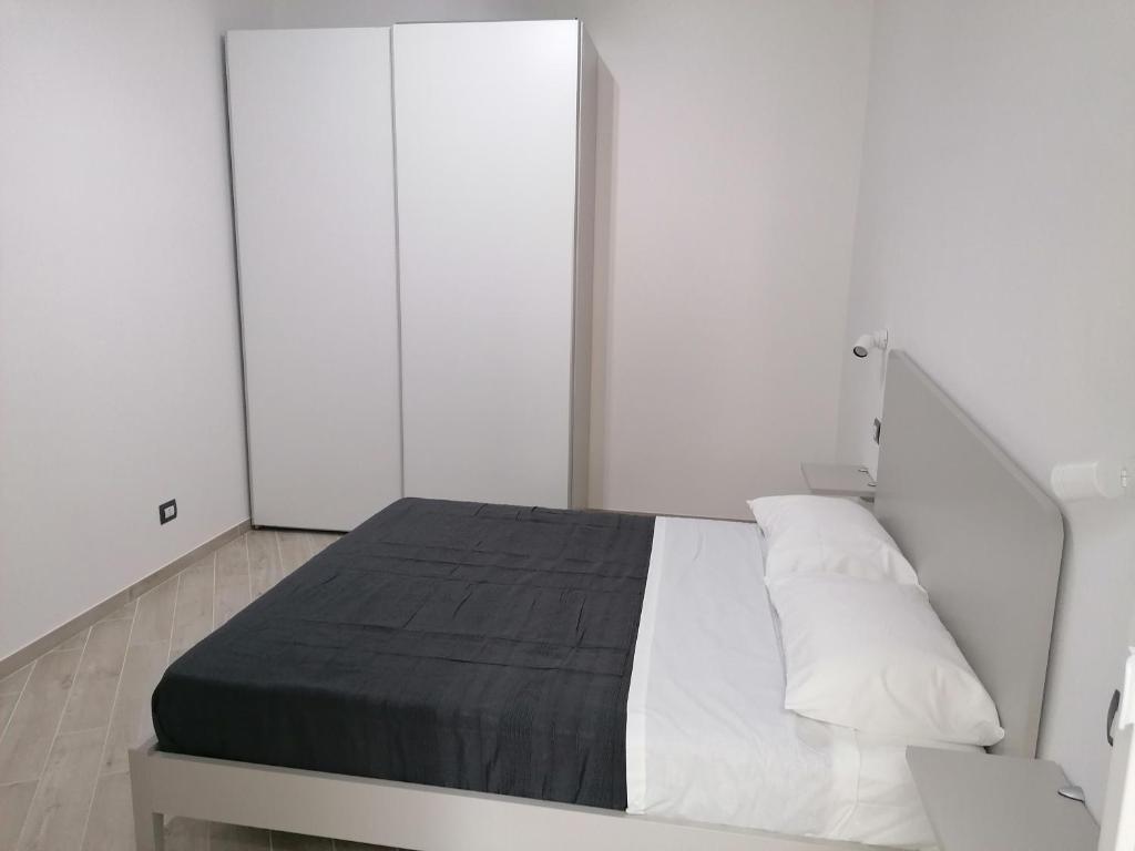 Posteľ alebo postele v izbe v ubytovaní Vasto in centro