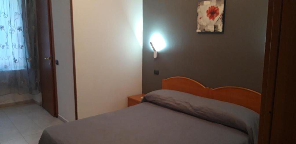 Postel nebo postele na pokoji v ubytování Hotel Milano