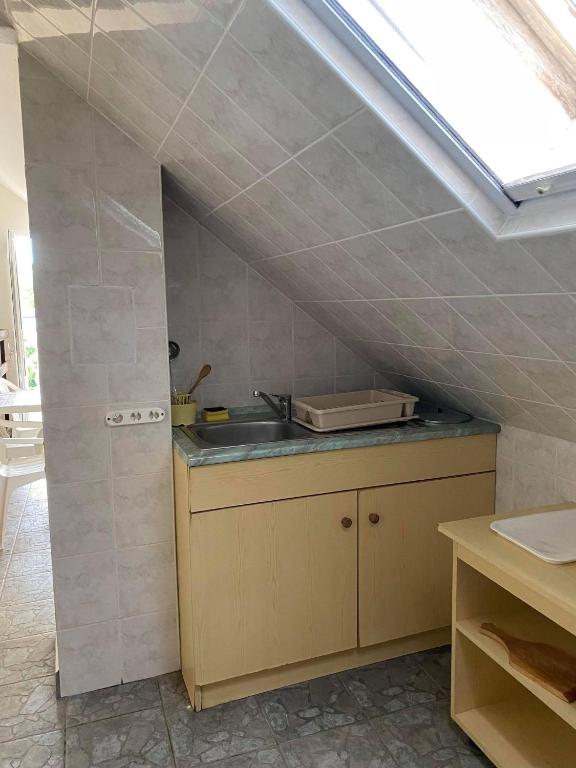 Kuchyň nebo kuchyňský kout v ubytování Birta Apartman