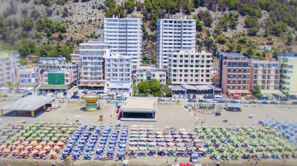 a large parking lot with a lot of parked cars at Apartment Suite Family in Shëngjin