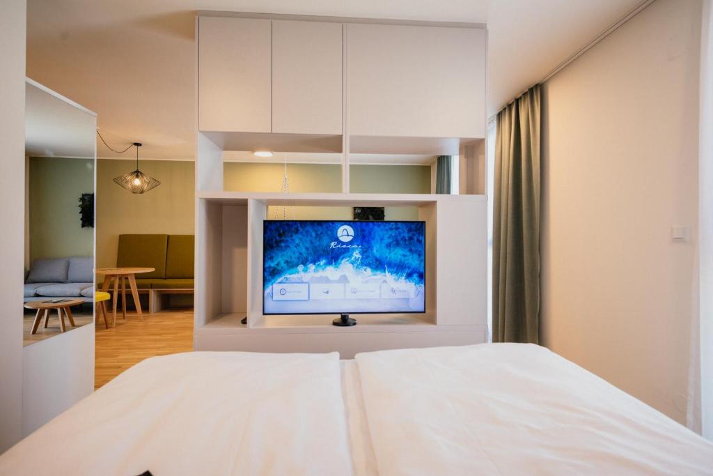TV a/nebo společenská místnost v ubytování Rioca Vienna Posto 1