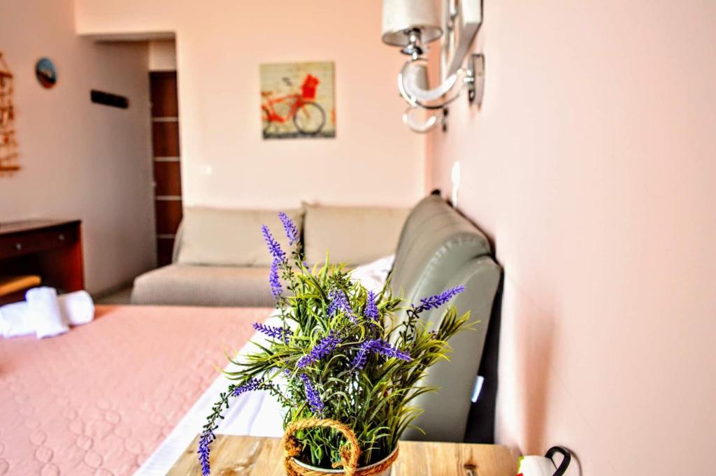 Postel nebo postele na pokoji v ubytování Olympic Hotel