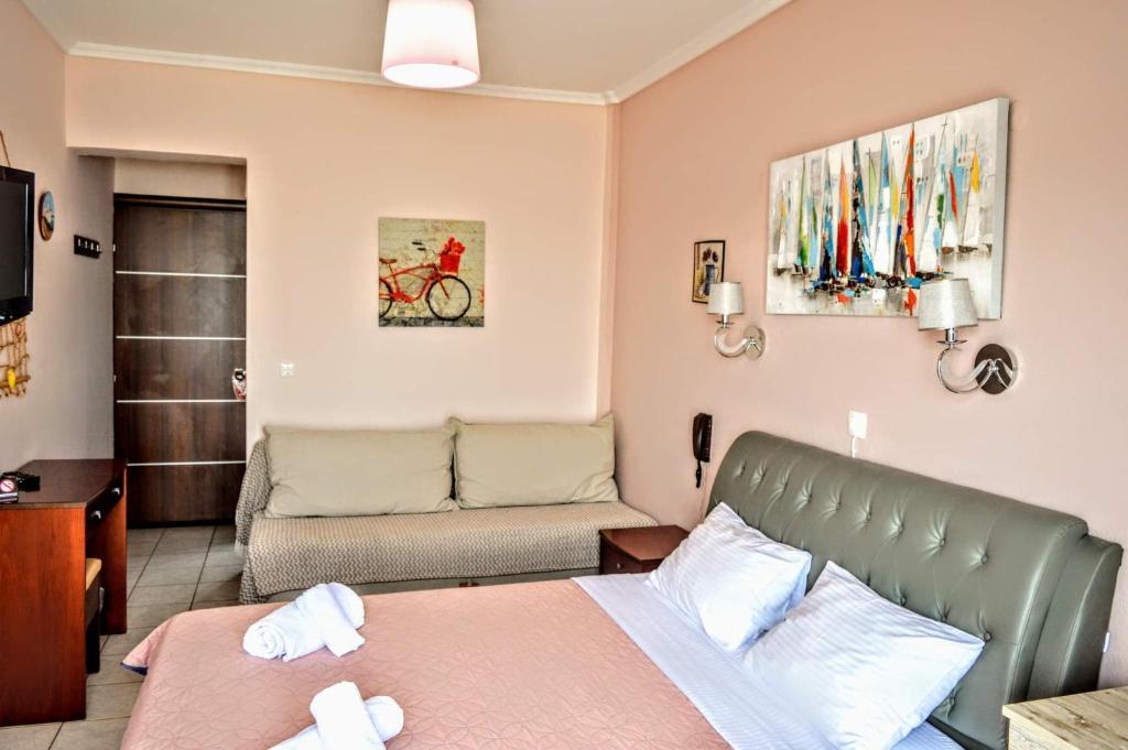 Postel nebo postele na pokoji v ubytování Olympic Hotel