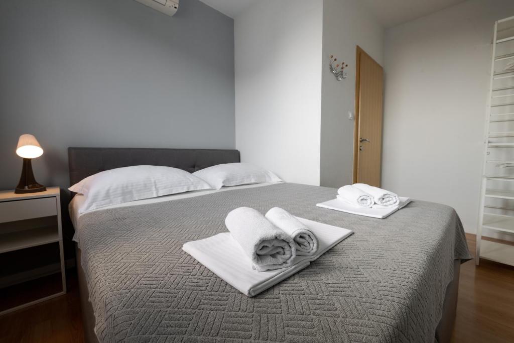 Posteľ alebo postele v izbe v ubytovaní Vidoš apartments
