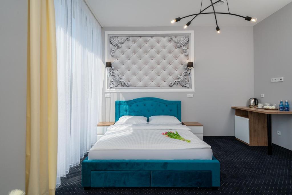 Posteľ alebo postele v izbe v ubytovaní Aquila Hotel