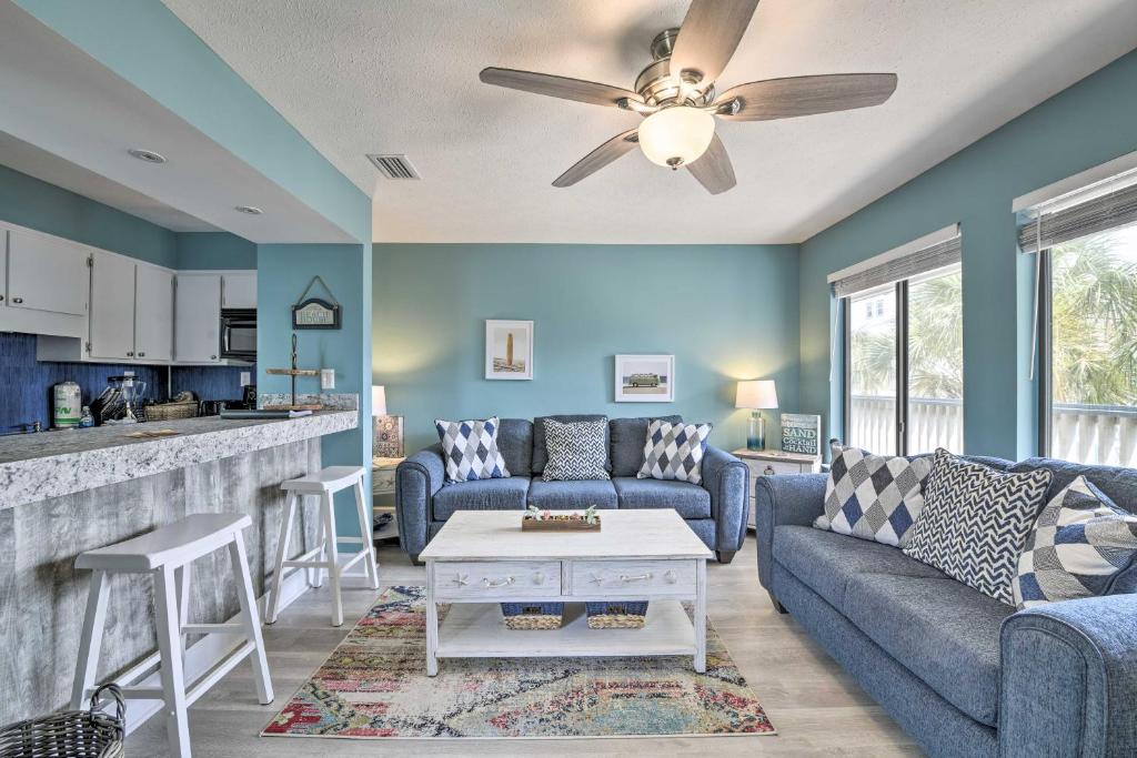 a living room with a couch and a table at Panama City Condo w/ Balcony & Pool, Walk to Beach in Panama City Beach