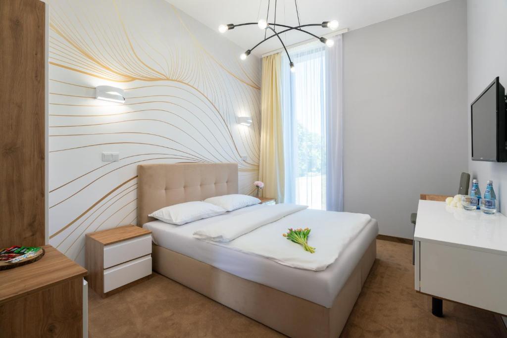 Posteľ alebo postele v izbe v ubytovaní Aquila Hotel