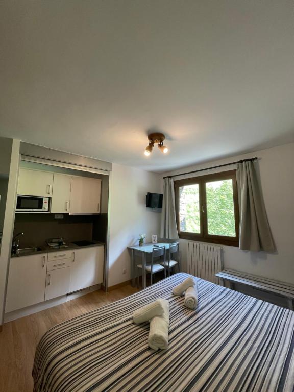 Postel nebo postele na pokoji v ubytování Aparthotel Sant Andreu