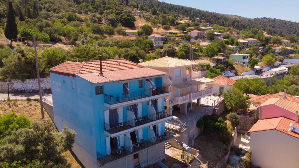 an aerial view of a house in a village at Elena Studios in Athanion