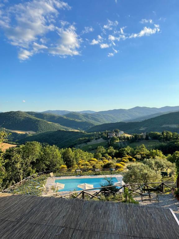 a view from the roof of a house with a swimming pool at Country House Ca' di Nieri - The Saints' Lodge in Monte Santa Maria Tiberina