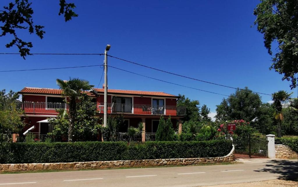 a house on the side of the road at Apartments Villa Amaryllis in Novigrad Istria