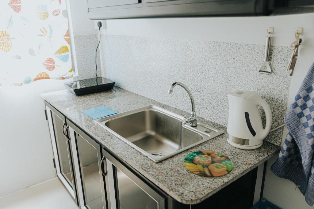 Kuchyň nebo kuchyňský kout v ubytování Luxe Exotica Apartments
