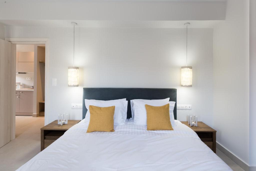 Postel nebo postele na pokoji v ubytování Calmare suites
