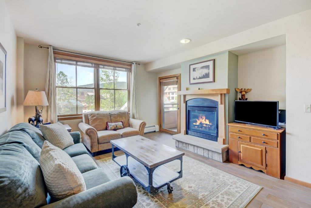 a living room with a couch and a fireplace at Ski In Out Luxury Condo #1221 With Hot Tub & Great Views - 500 Dollars Of FREE Activities & Equipment Rentals Daily in Winter Park